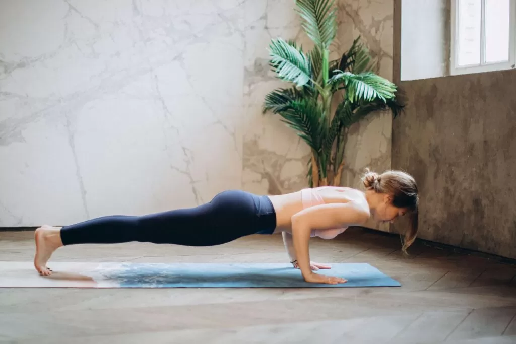 Woman doing a push up.