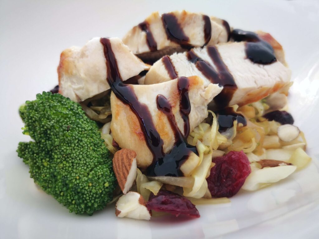 chunks of chicken with broccoli and almonds.