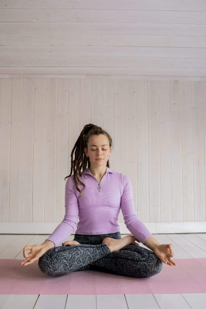 Young girl in a yoga pose.