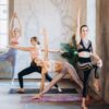 Woman in yoga poses stretching on yoga mats