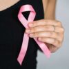 Woman in Black Tank Top Holding Pink Ribbon