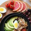 Variety of Food on Wooden Coaster with fruits and vegetables.