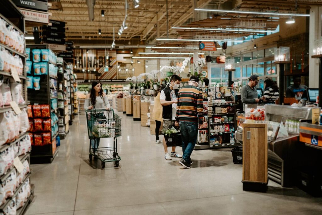 People walking around a supermarket.