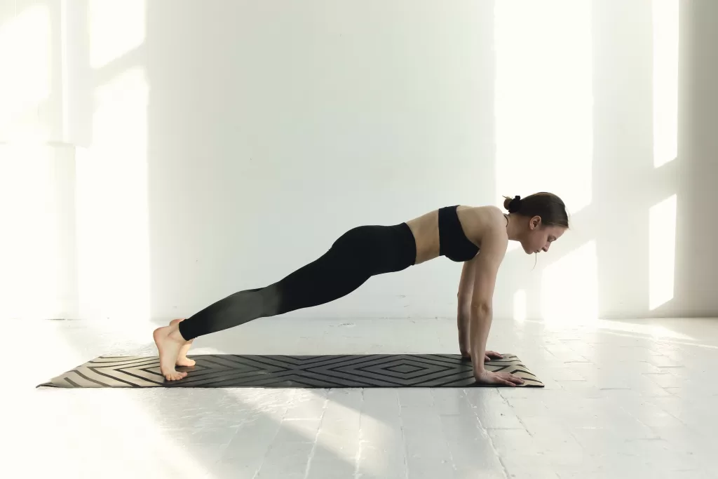 Woman doing a push up.