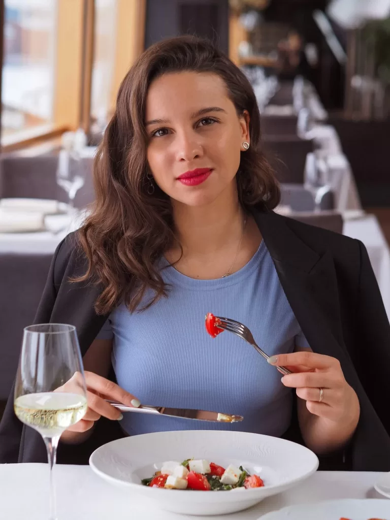 Woman eating a salad.