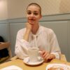 A women smiling during her breast cancer treatments.