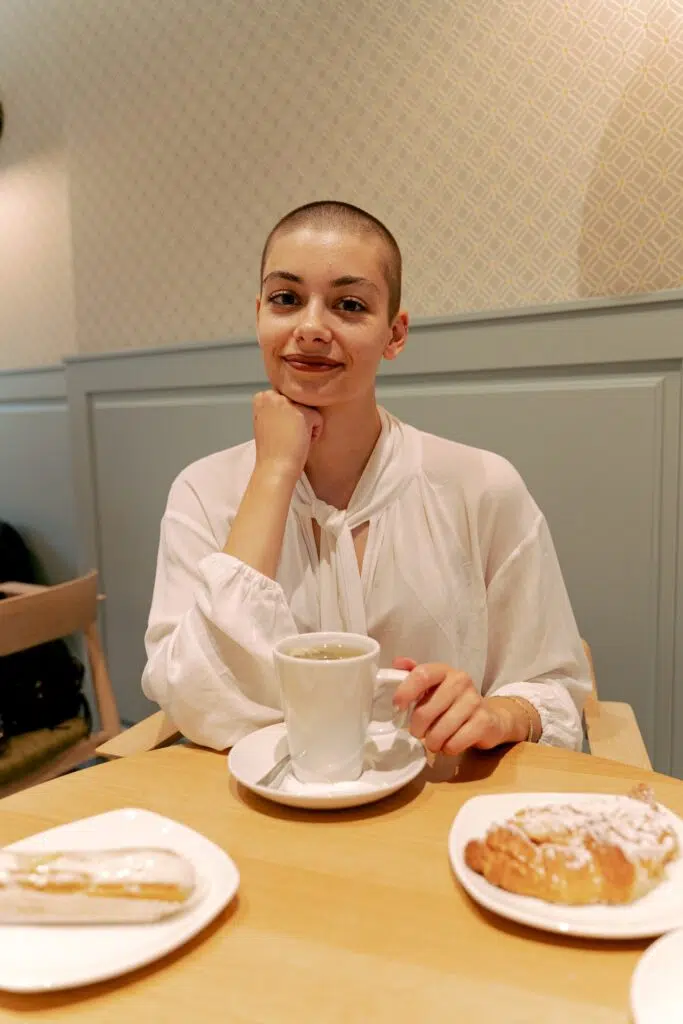 A women smiling during her breast cancer treatments.