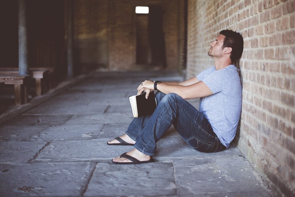 alone, book, brick wall-1869997.jpg