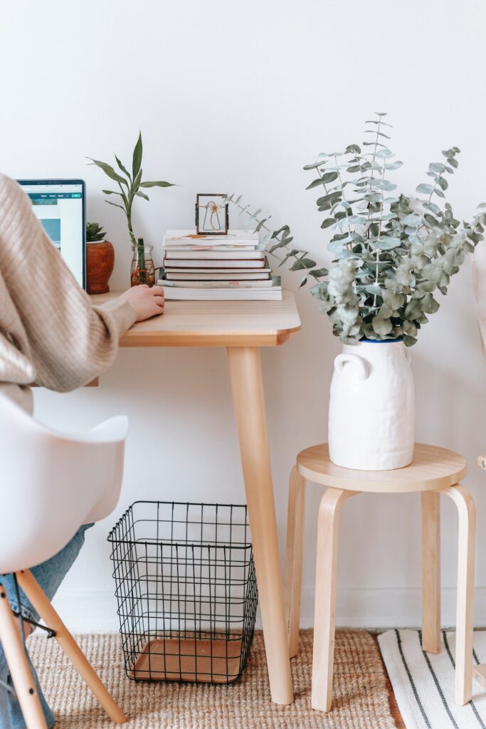 A woman practicing self-care at her workplace.