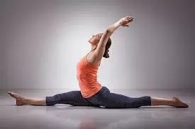 Woman practicing Hatha yoga on the floor in yoga position.