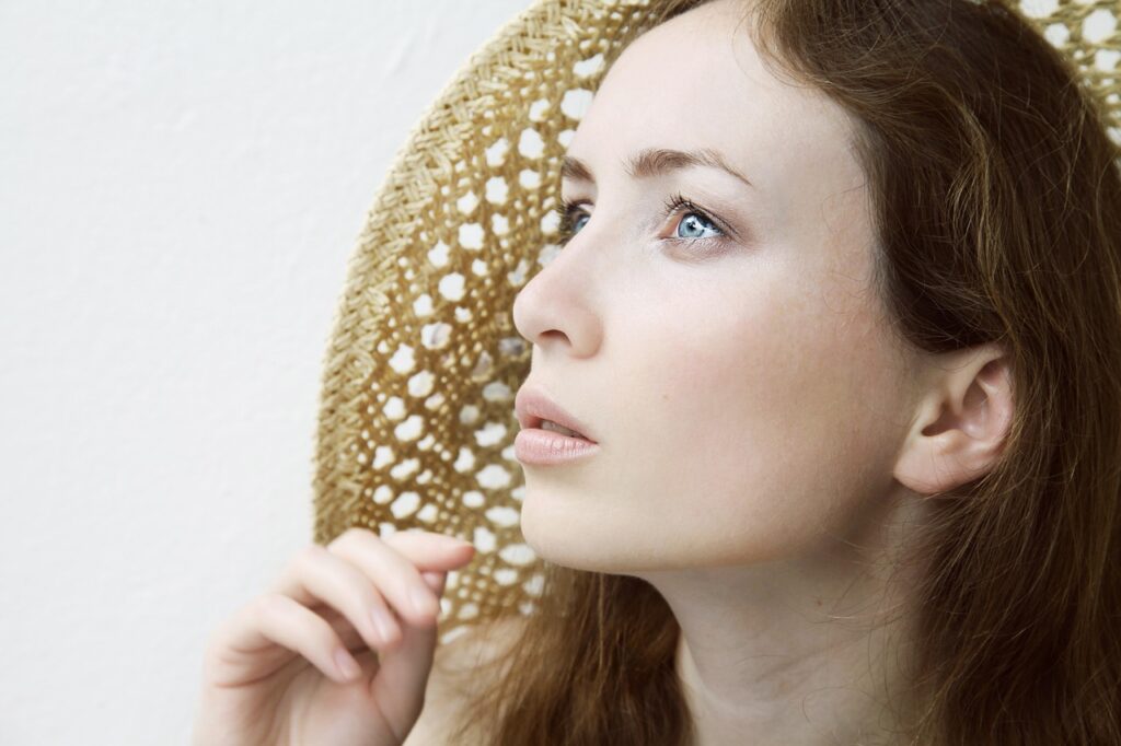 A beautiful attractive woman staring upward.