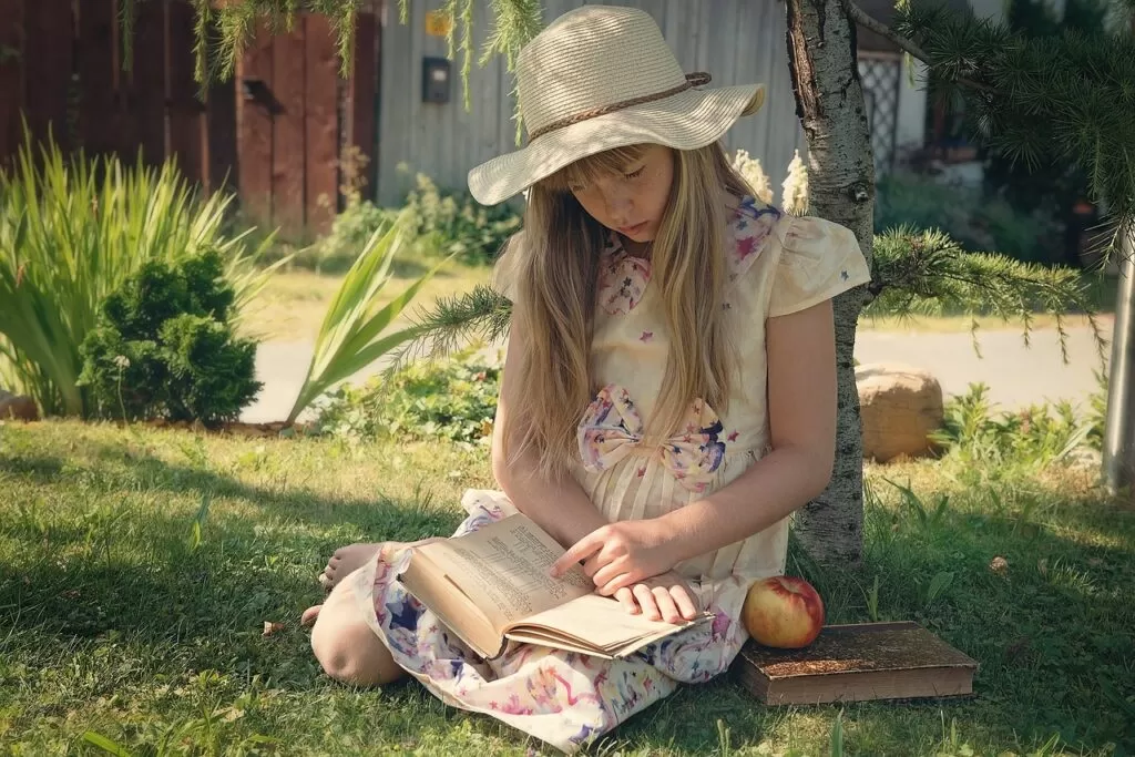 A girl reading a health and wellness book.