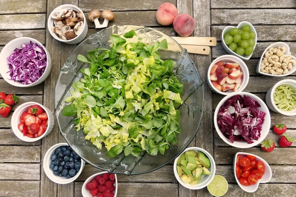 A fruit and vegetable health and wellness salad with fruit and berries.