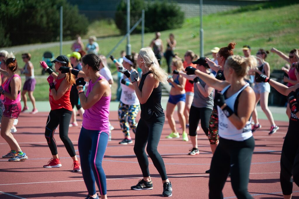 Women exercising together at a Zumba, party, marathon.