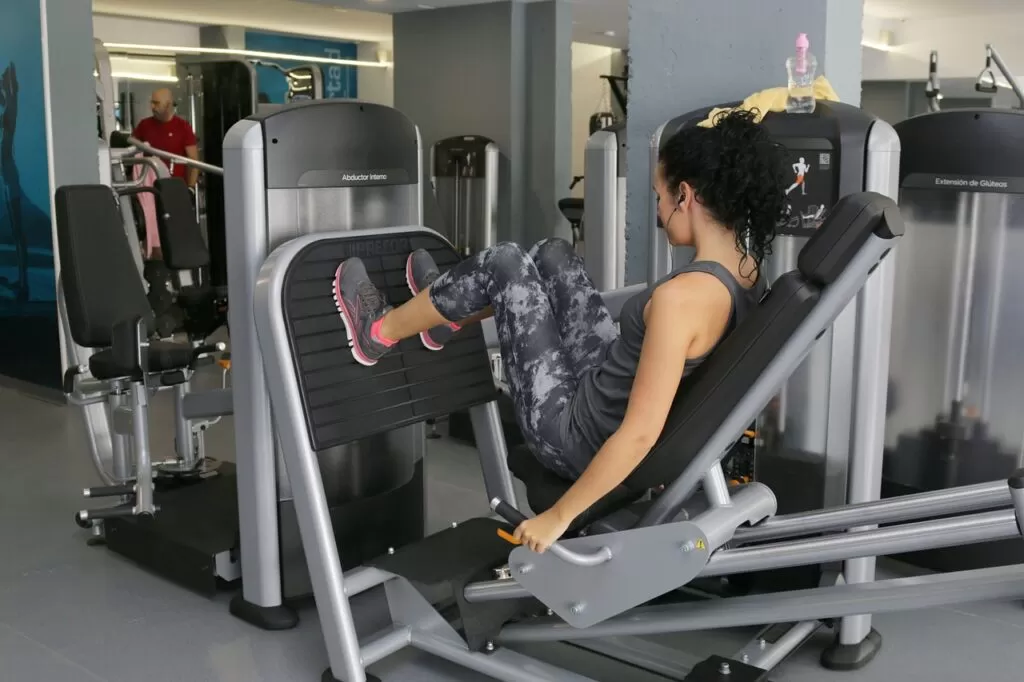 a woman exercising on gym equipment