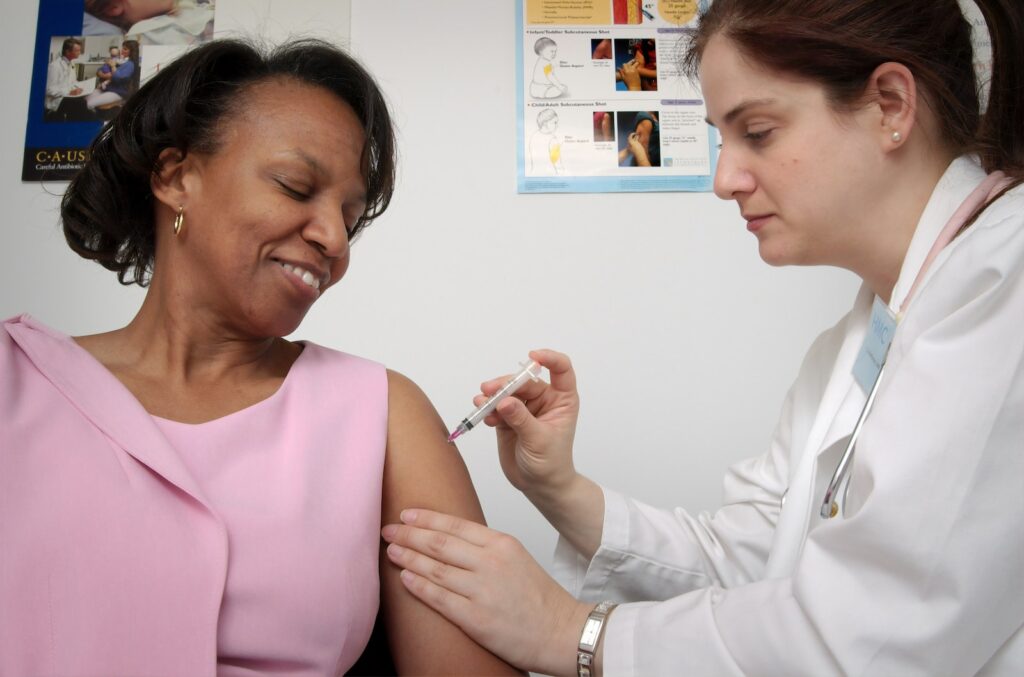 woman getting vaccine for disease prevention