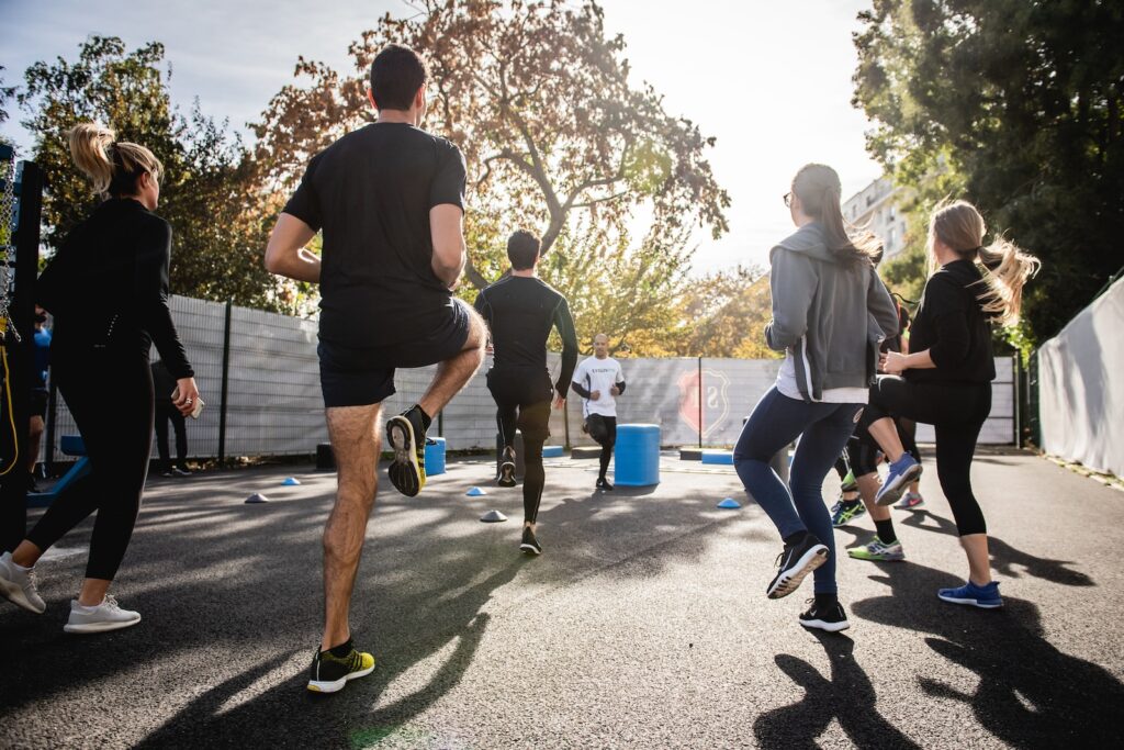 people doing their morning exercise program together outside