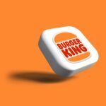 a burger king logo on an orange background